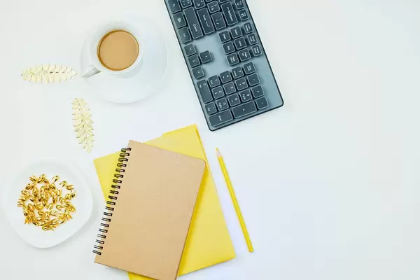 Designer workspace on desk table essential elements on flat lay