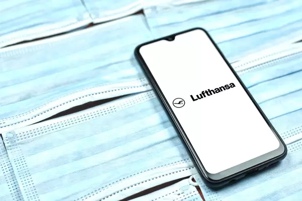 Deutsche Lufthansa AG logo on phone display. Covid-19 effect on company business