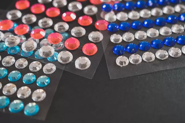 Diamond stickers on a black surface