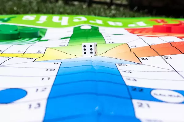 Dice over giant board game mat