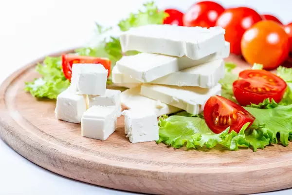 Diced feta cheese with tomatoes and lettuce