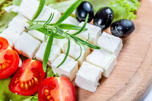 Diced feta cheese with tomatoes and olives  Flip 2019