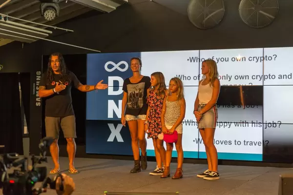 Didi Taihuttu with his bitcoin family on stage of the Digital Nomad Festival DNX in Lisbon