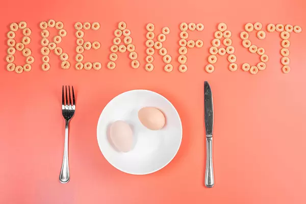 Diet concept - two chicken eggs for breakfast, top view