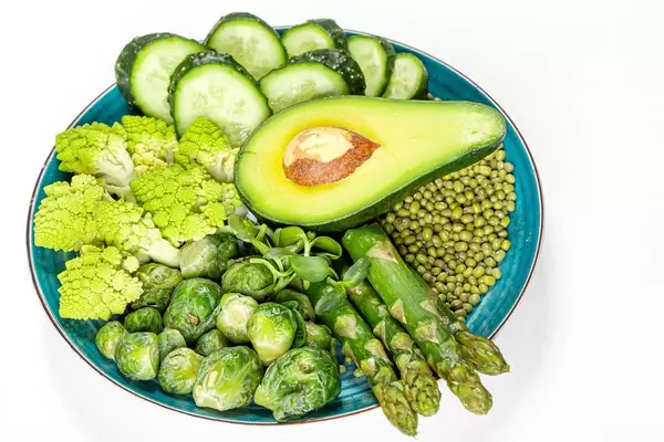 Diet food concept, green fresh vegetables and mung beans in a plate on a white background (Flip 2020)