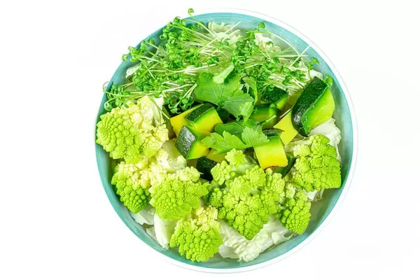 Diet green salad on a white background. The view from the top (Flip 2020)