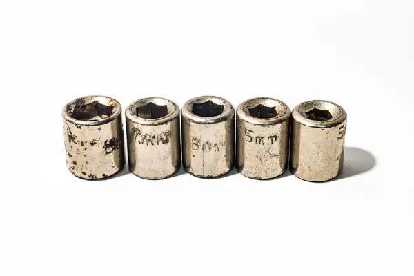 Different bolt nut sizes on white background