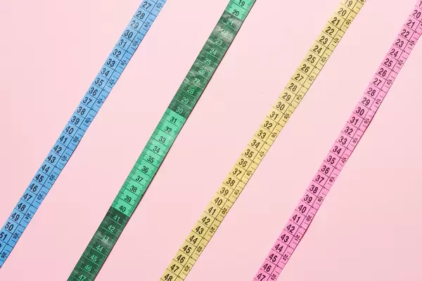 Different colorful plastic measuring tapes
