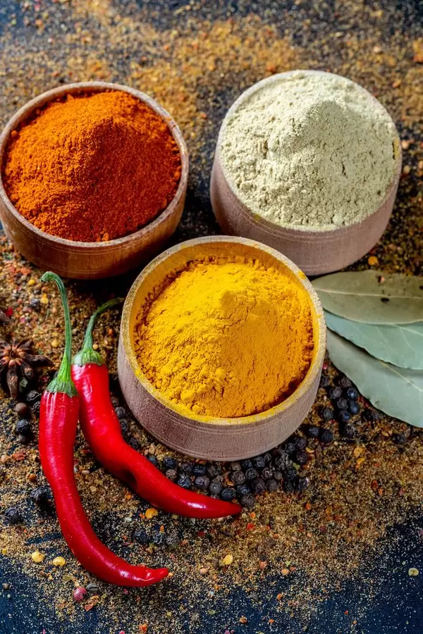 Different kind of spices on a black background