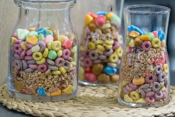 Different kinds of breakfast cereals in glass containers
