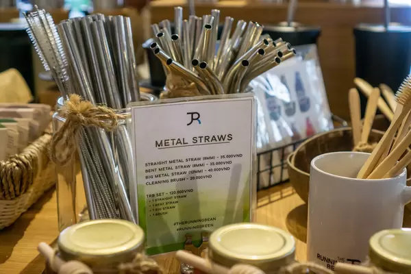 Different kinds of Metal Straws, Cleaning Brushes, Bamboo Toothbrushes and other Items for Sale in a Cafe