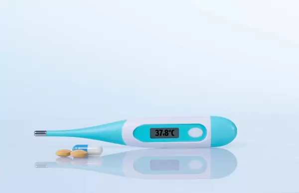 Digital thermometer showing 37,8°C temperature