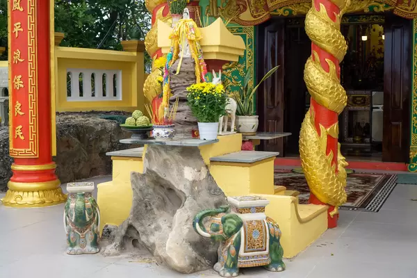 Dinh Cau Shrine with Elephant Statues, Lady Buddha, Incense Sticks and Offerrings on Phu Quoc Island, Vietnam