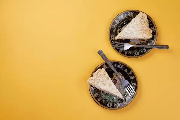 Directly above shot of two plates with delicious cakes