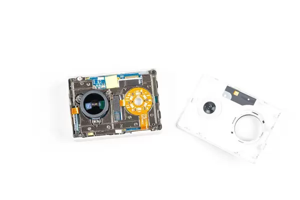 Disassembled action camera on a white background
