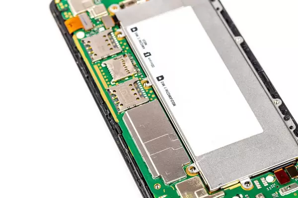 Disassembled cell phone on white background (Flip 2020)