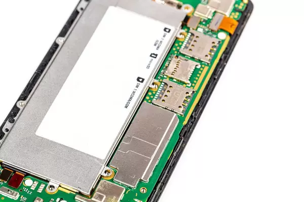 Disassembled cell phone on white background