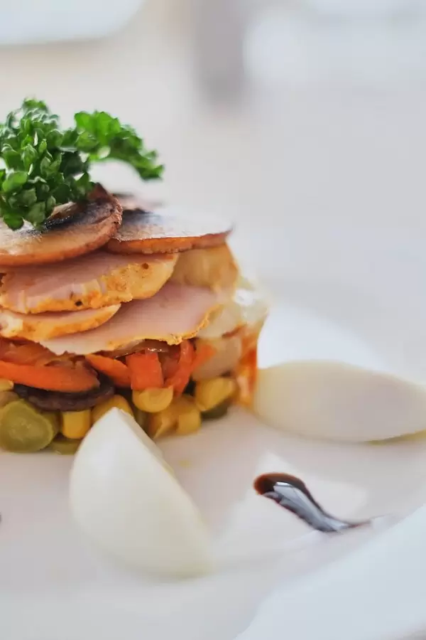 dish with mushrooms ham carrots and corn with eggs side view  Flip 2019