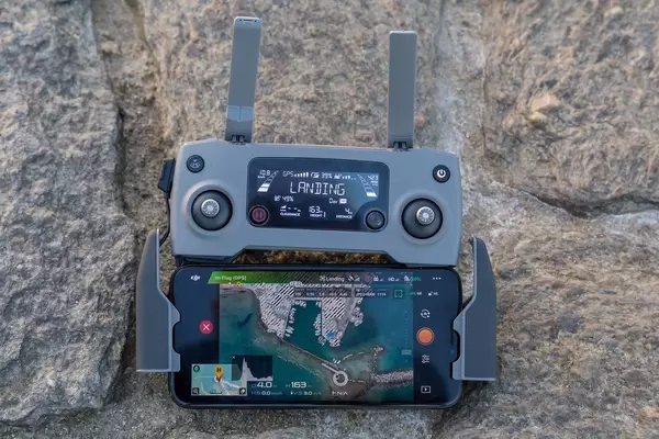 DJI Mavic 2 Controller with smartphone to watch the drone flight over Paros Island in Greece