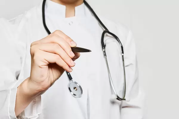 Doctor hand writing with a pen