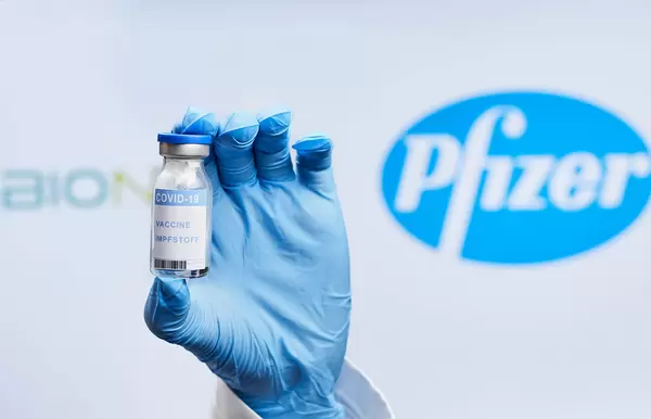Doctor holding BioNTech and Pfizer Covid-19 vaccine