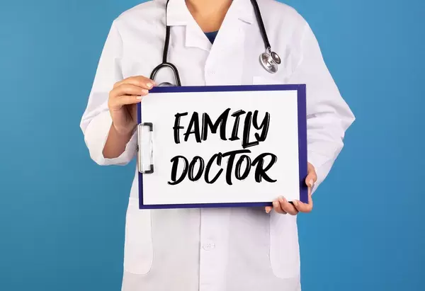Doctor holding clipboard with Family doctor text