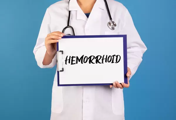 Doctor holding clipboard with Hemorrhoid text
