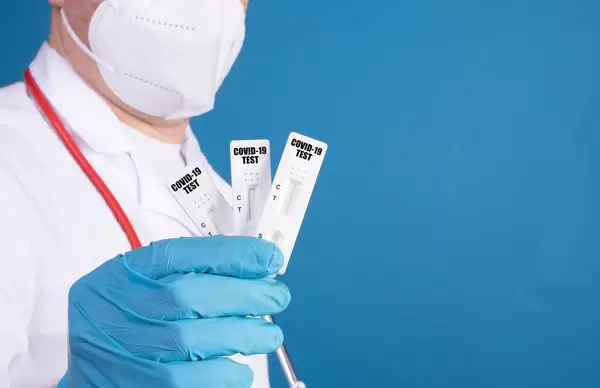 Doctor showing Covid-19 antigen tests