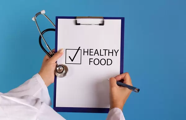 Doctor with prescription start eating healthy food
