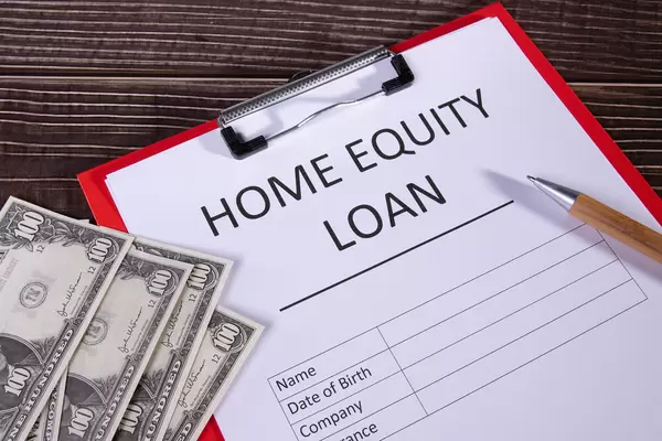 Document with name home equity loan on a desk