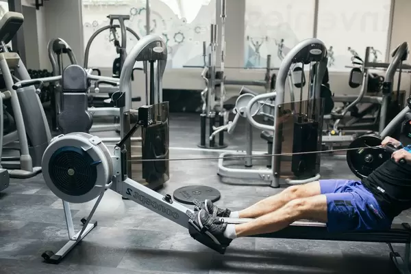 Doing exercise on a rowing machine  Flip 2019