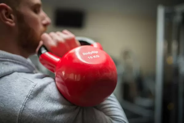 Doing Kettlebell Push Press with one arm