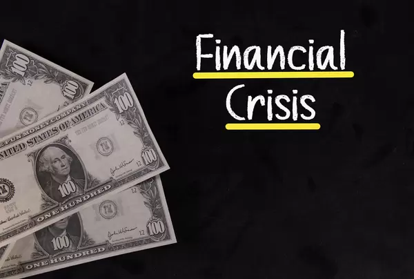 Dollar banknotes with Financial Crisis text