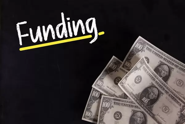 Dollar banknotes with Funding text