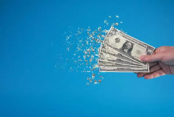 Dollar bills tearing apart