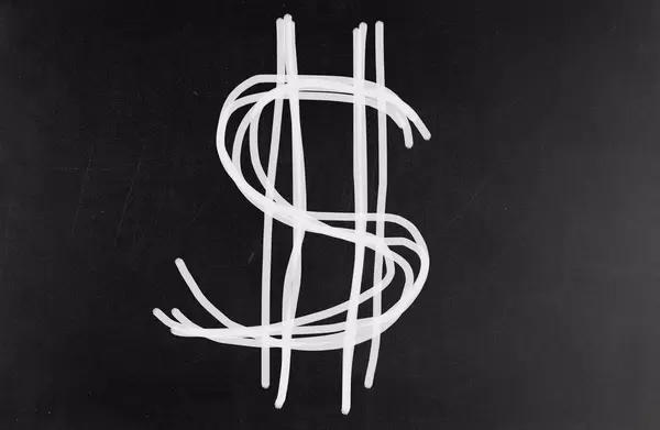 Dollar symbol on blackboard