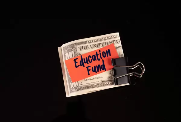 Dollars in money clip with Education Fund text