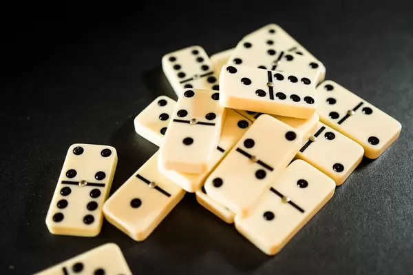 Dominoes pieces on a balck surface
