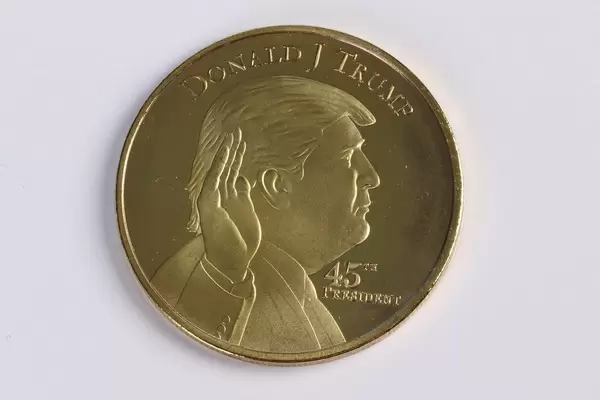 Donald Trump on a golden coin