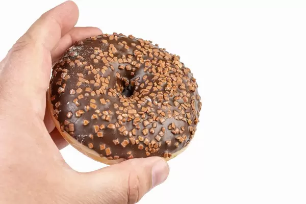 Donut with Chocolate Topping in the hand