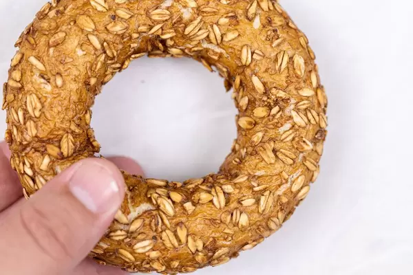 Donut with Olives in the hand