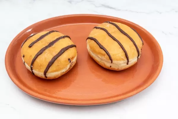 Donuts with Chocolate topping served on the plate (Flip 2019)