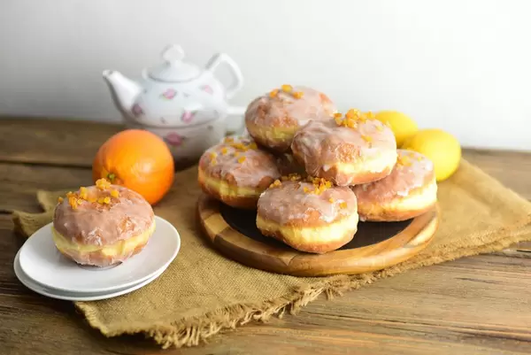 Donuts with icing and candied orange peel