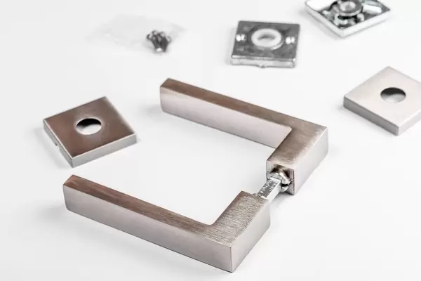 Door handle on white background with details for its installation (Flip 2019)