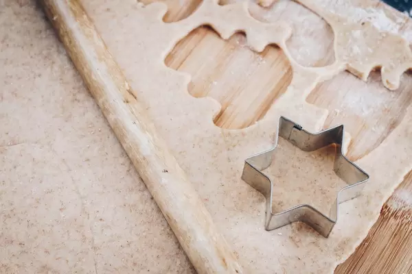 Dough with star shaped cookie cutter. Cooking preparation