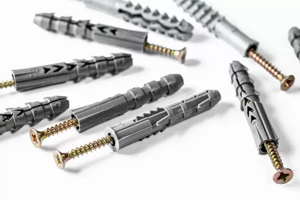 Dowels and screws on white