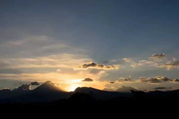 Dramatic sunset behind volcanoes