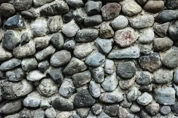 Dramatischer Steinhintergrund – Nahaufnahme einer Wand aus Steinen