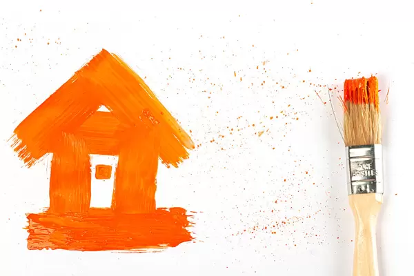 Drawn house with orange splashes and brush