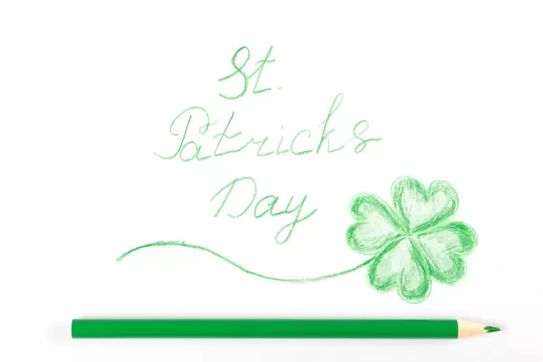 Drawn st patrick's day greeting on white with green pencil